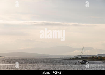 sunset over the Connel bridge and Lora waterfall Stock Photo