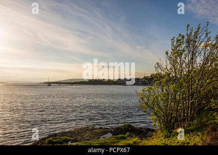 sunset over the Connel bridge and Lora waterfall Stock Photo