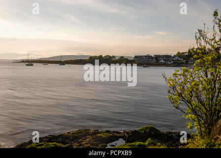 sunset over the Connel bridge and Lora waterfall Stock Photo