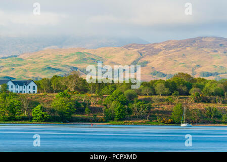 sunset over the Connel bridge and Lora waterfall Stock Photo