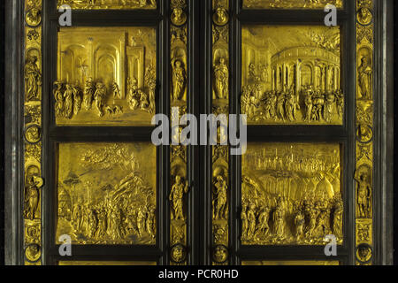 Detail of the Gates of Paradise (Porta del Paradiso) designed by Italian Early Renaissance sculptor Lorenzo Ghiberti for the Florence Baptistery (Battistero di San Giovanni), now on display in the Museo dell'Opera del Duomo (Museum of the Works of the Florence Cathedral) in Florence, Tuscany, Italy. The stories of Jacob and Esau, Joseph and his brothers, Moses and Joshua are depicted in the panels from left to right from above to bellow. Stock Photo