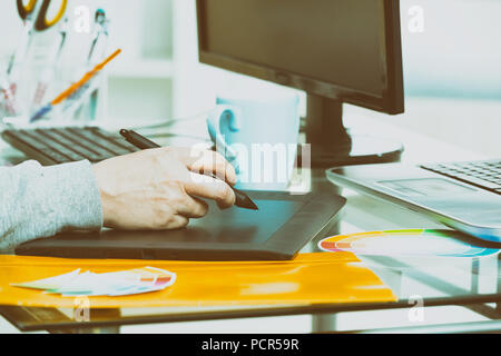 Designer using graphics tablet in the office Stock Photo