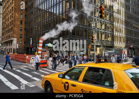 steam leak coming out a temporary chimney at a busy midtown street in Manhattan Stock Photo