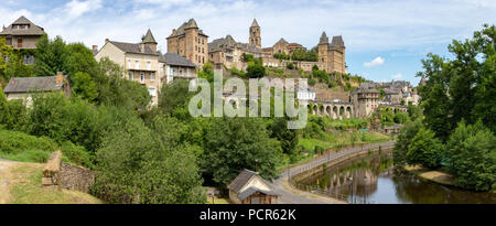 FRANCE, UZERCHE - JULY 12, 2018: Panorama of the picturesque medieval village with the river Vezere in front of it. Stock Photo