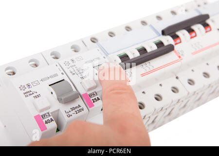 Electric fuses. Man turning off the fusebox. Stock Photo