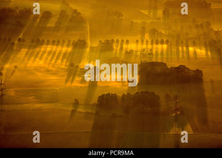 Sunrise over the eastern districts of Hamm, view over the farming communities of Hamm, eastern landscape of Hamm, morning sun, long shadows, morning mood, rows of trees, Hamm, Ruhr area, North Rhine-Westphalia, Germany Stock Photo