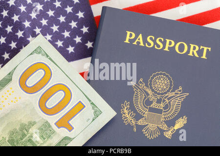 American Passport Close Up With Money on Top of USA Flag. Stock Photo