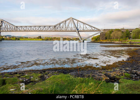 sunset over the Connel bridge and Lora waterfall Stock Photo