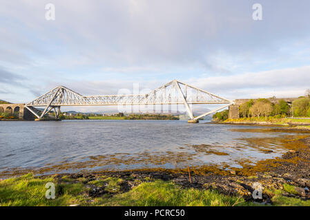 sunset over the Connel bridge and Lora waterfall Stock Photo