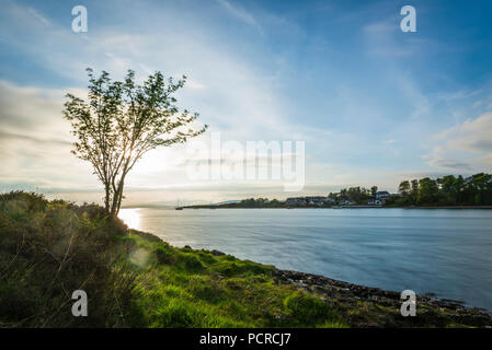 sunset over the Connel bridge and Lora waterfall Stock Photo