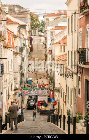 Typical hilly street in the Bairro Alto area of Lisbon Portugal. Stock Photo