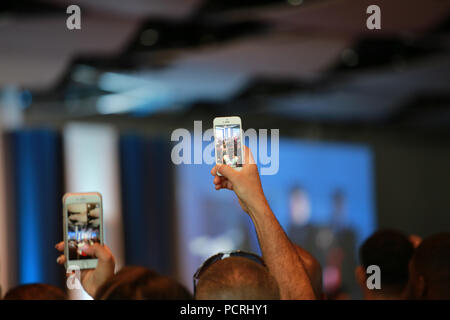 people taking pictures at an event Stock Photo