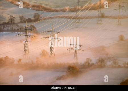Overland power lines, sunrise over Hamm, aerial view of Hamm, Ruhr area Stock Photo
