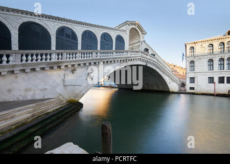 Rialto bridge and The Grand Canal in Venice, nobody in the calm morning, Italy Stock Photo