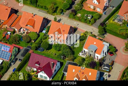 Aerial view, new housing estate, brick buildings with red tiled roofs, single-family houses and terraced housing, home gardens, Billerbeck, Münsterland, North Rhine-Westphalia, Germany Stock Photo