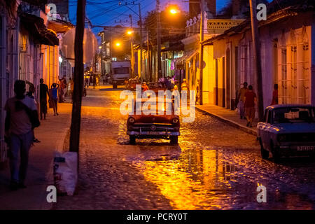 nocturnal street scene in the historic city centre of Trinidad with vintage cars and lanterns, Trinidad, Cuba, Sancti Spíritus, Cuba Stock Photo