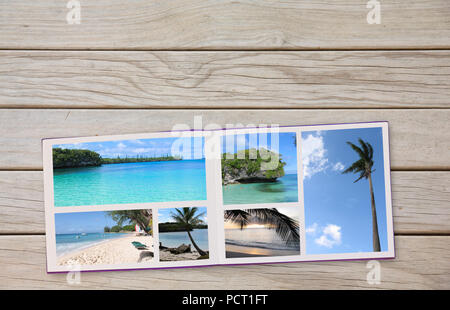 Photobook Album on Deck Table with Travel Photos of beaches and Coffee or Tea in Cup Stock Photo
