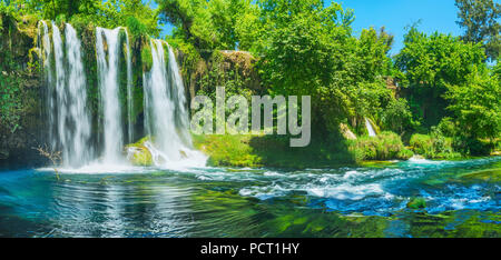Panorama of the deep narrow canyon of Upper Duden Waterfall with lush greenery on banks of Duden river, Antalya, Turkey. Stock Photo