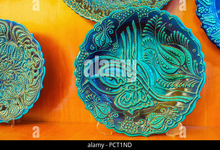 ANTALYA, TURKEY - MAY 11, 2018: The carved souvenir plate in blue gamma, decorated with Ottoman tughra - calligraphic monogram of Sultan, on May 11 in Stock Photo