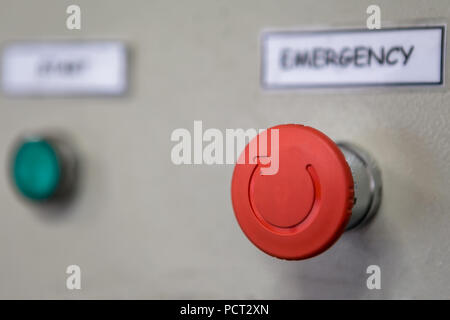 Close up of emergency stop button switch, an electrical device for safety Stock Photo