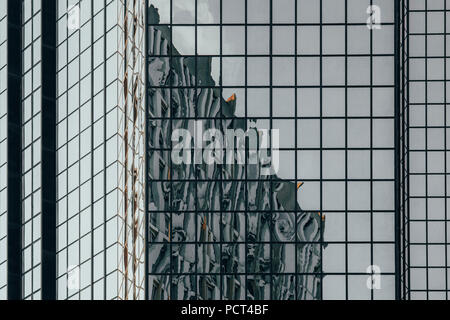 Reflections of buildings in the glass facade of a skyscraper, Beaugrenelle shopping mall, Paris, France Stock Photo