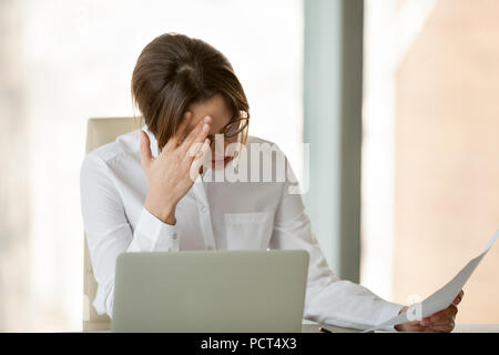 Frustrated female employer disappointed with company business fa Stock Photo