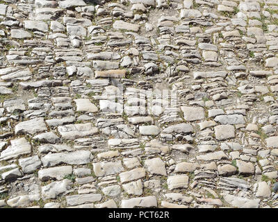 Texture of a shabby old pavement of cobblestones Stock Photo