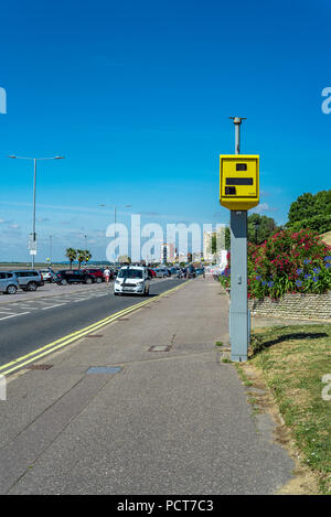 Yellow speed camera on an urban street. Traffic enforcement operating along the seafront at Southend on sea. Stock Photo