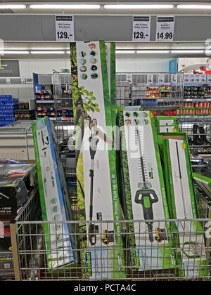 Centre Aisle of a discount supermarket, Lidl, Aldi, lawnmowers, hedge trimmers, Latchford, Warrington, Cheshire, North West England, UK Stock Photo