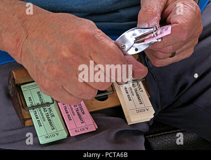 Tram tickets, being punched, Birkenhead Tramways, Merseyside, North West England, UK Stock Photo