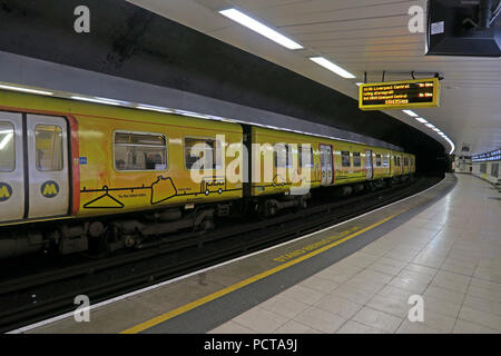 Yellow Merseyrail, Liverpool EMU underground train, at Birkenhead Hamilton Square Railway Station, Merseyside, North West England, UK