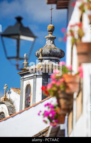 Picturesque facades with primroses and flower pots, picturesque town of Obidos, Óbidos, Leiria district, Portugal, Europe Stock Photo