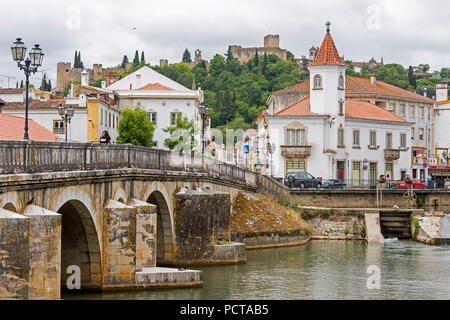 Renaissance bridge Ponte Velha over the Nabao near the old town of Tomar with the Convento de Cristo in the background, Tomar, Santarém district, Portugal, Europe Stock Photo