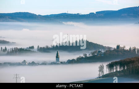 Eversberg, oldest half-timbered village of the Sauerland looking out of the cloud cover, church Eversberg, Meschede, Sauerland, North Rhine-Westphalia, Germany Stock Photo