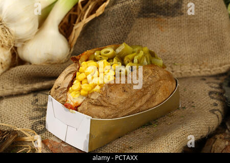 Kumpir, Turkish Baked potato with cheese, corn and sausage Stock Photo