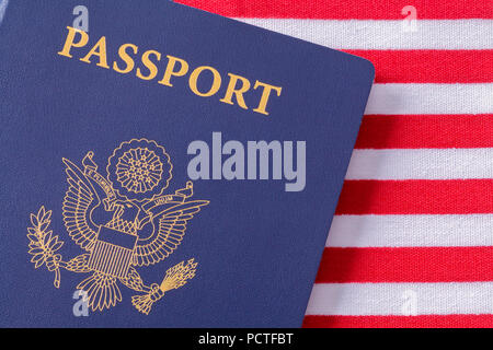 American Passport Close Up on Top of USA Flag. Stock Photo