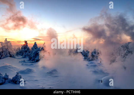 View from the Brocken Railway on the snowy winter landscape at the summit of the Brocken (1142m) in evening light, Harz, Saxony-Anhalt, Germany Stock Photo