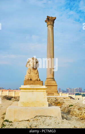 The Pompey's Pillar and statues of sphinxes are the notable landmarks of Amoud Al Sawari archaeological site, also including ruins of Serapeum Temple  Stock Photo