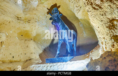 ALEXANDRIA, EGYPT - DECEMBER 18, 2017: The statue of sacred Apis bull in catacombs of Serapeum Temple, Amoud Al Sawari archaeological site, on Decembe Stock Photo