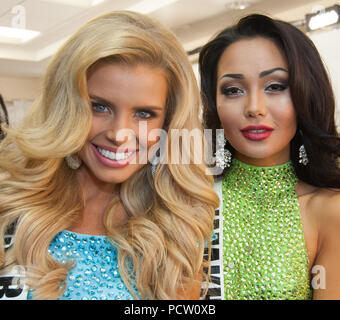 DORAL, FL - JANUARY 25:  Tegan Martin, Miss Australia, Aiday Issayeva, Miss Kazakhstan 2014 gets her makeup done by an O.P Makeup artist backstage at the 63rd Annual Miss Universe Pageant at Trump National Doral on January 25, 2015 in Doral, Florida.  People:  Tegan Martin, Miss Australia, Aiday Issayeva, Miss Kazakhstan Stock Photo