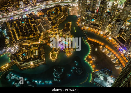 Detail aerial view at night of downtown Dubai and artificial lake, United Arab Emirates. Stock Photo