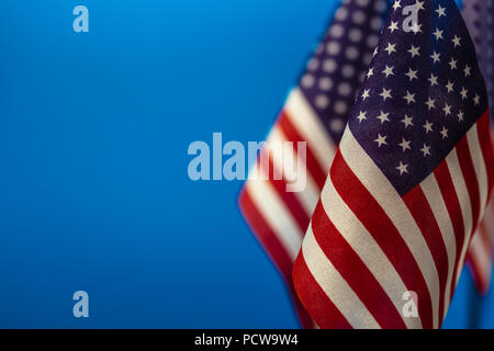 Flags United States of America with blue background empty space for your text on left. Stock Photo