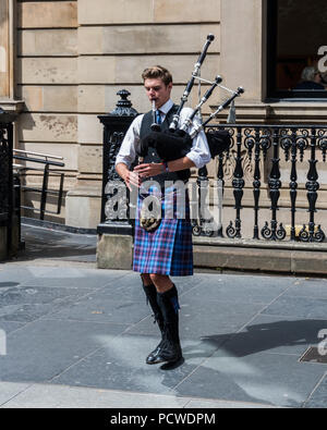 Bagpipe Player on Buchanan Street in Glasgow, Scotland, UK Stock Photo