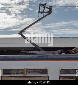 The pantograph on 319424 at Blackpool,  the 0843 Blackpool North - Manchester Airport First passenger carrying electric service to depart Blackpool Stock Photo