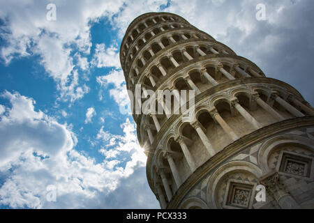 The Leaning Tower of Pisa, Italy, famous for its tilt, with the cloudy sky.  The tower is originally a bell tower of the nearby Pisa Cathedral Stock Photo