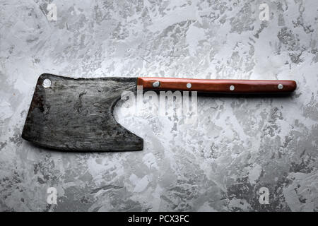 Old rustic axe for meat on grunge background Stock Photo