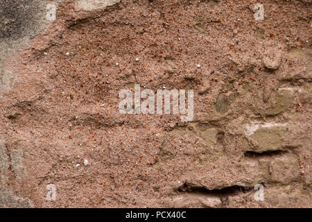 background with old texture of broken cement wall in reddish color Stock Photo