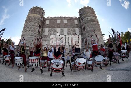 Dorset, UK, 4 Aug 2018. Batala Portsmouth Samba Reggae Band play in front of Lulworth Castle at Bestival, Dorset, UK Credit: Finnbarr Webster/Alamy Live News Stock Photo