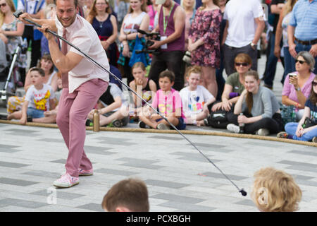 Stockton-on-Tees, UK. Saturday, 4th August, 2018. A street performer from Max Calaf Seve engages with the audience during a performance of 'Dip' at the 31st Stockton International Riverside Festival. Credit: Andrew Nicholson/Alamy Live News Stock Photo