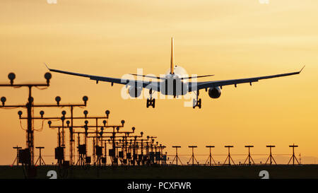 Richmond, British Columbia, Canada. 24th Apr, 2013. An Airbus A330 wide-body jet airliner lands at sunset, Vancouver International Airport, Canada. Credit: Bayne Stanley/ZUMA Wire/Alamy Live News Stock Photo